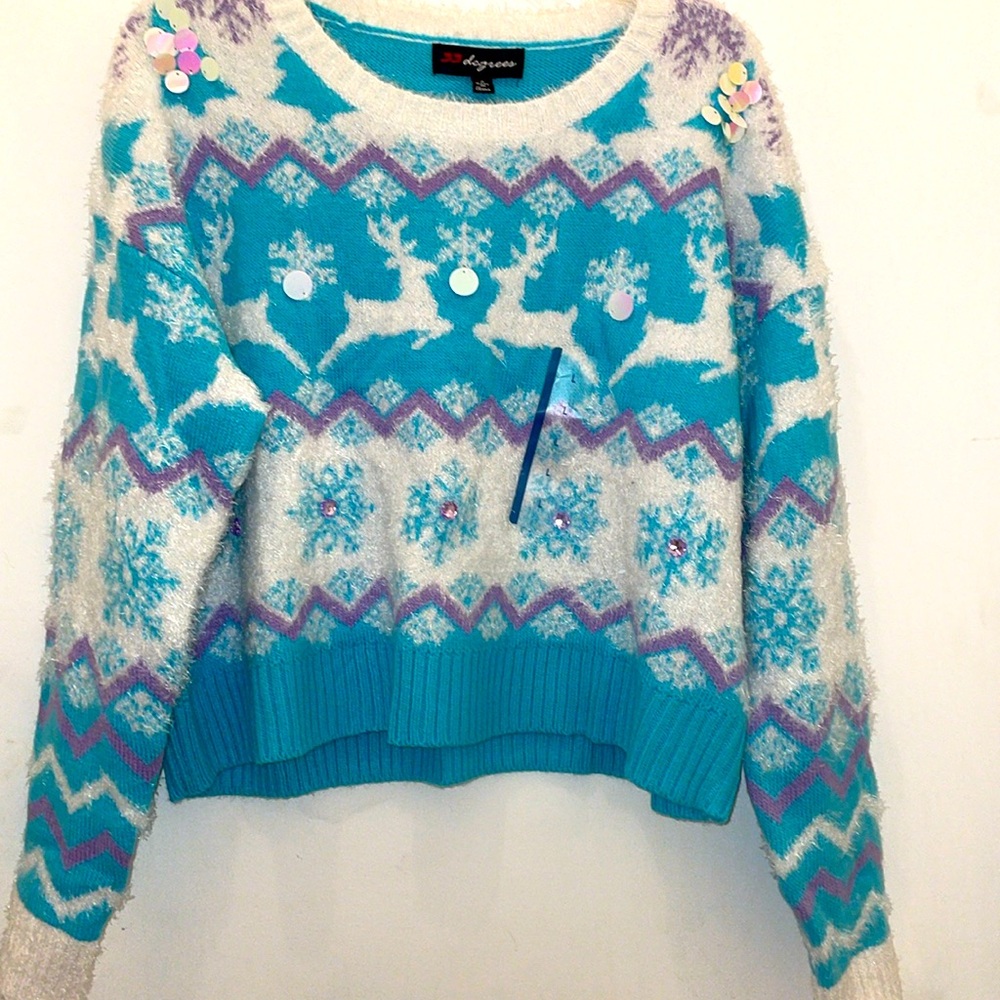 Woman’s teal and white fair isle Christmas sweater